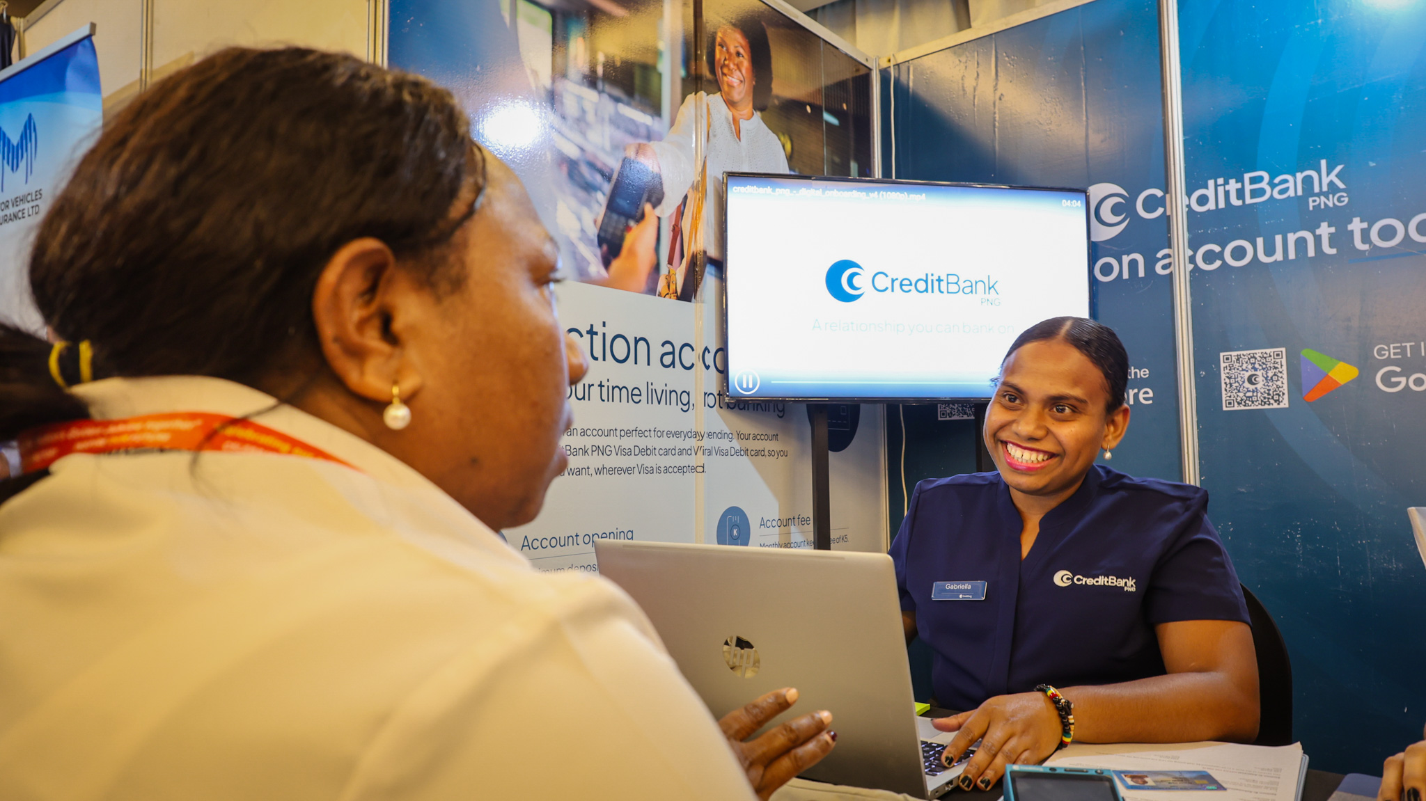 CBP staff assisting a customer open her Transaction account